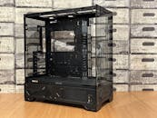 Sleek Black PC Gaming Tower Case on Wooden Surface