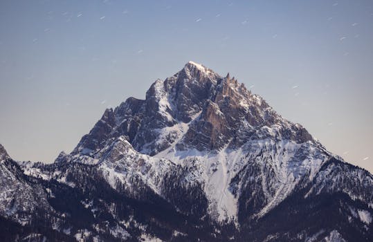 Stunning night view of a snow-capped mountain in Trentino-South Tyrol, Italy. Ideal for nature and travel enthusiasts.