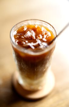 Deliciously chilled iced coffee with ice cubes, perfect for summer refreshment.