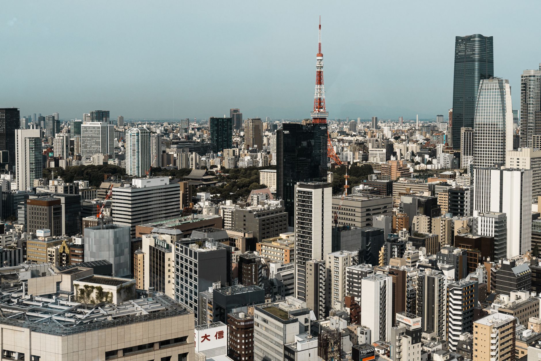 Tokyo Sunset Panoramic view of the Tokyo skyline at sunset, featuring iconic skyscrapers and a bustling city.
