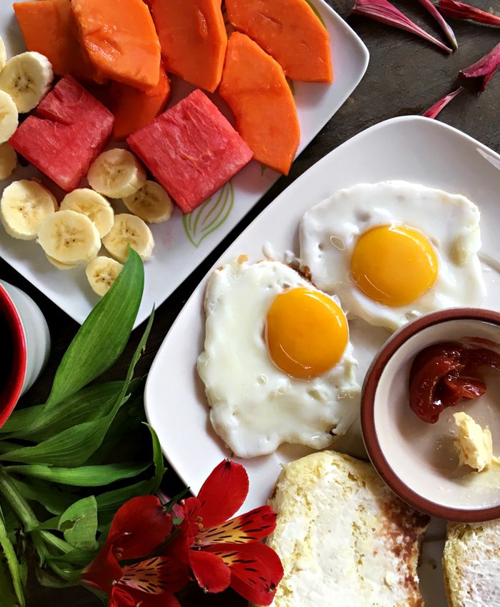 A slow island breakfast of fresh fruit and coffee.