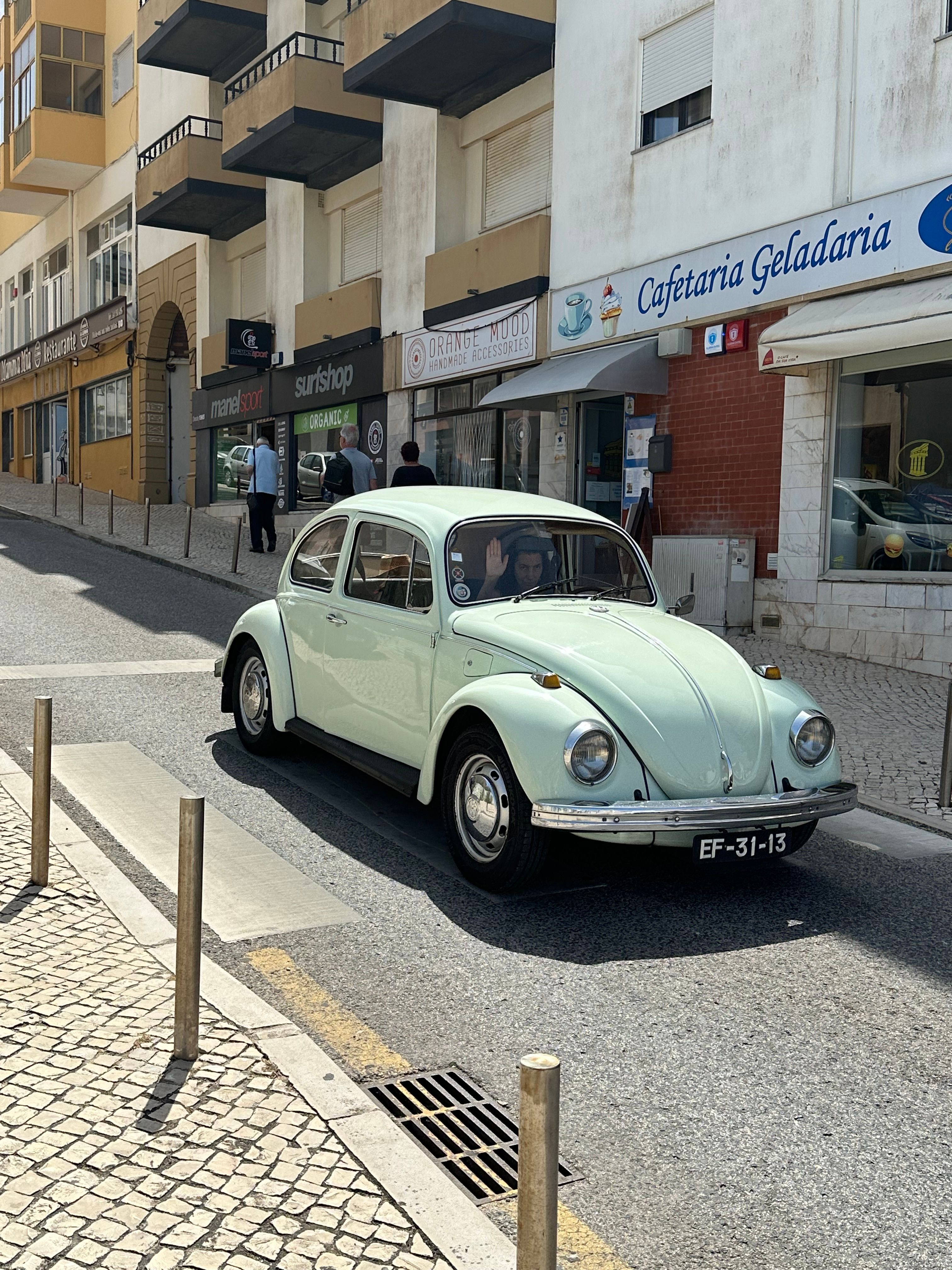 Vintage Beetle Car on Sunny Portuguese Street · Free Stock Photo