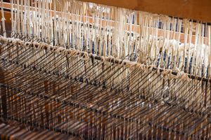 Alpaca wool warp threads on a weaving loom, photo by Magda Ehlers on Pexels