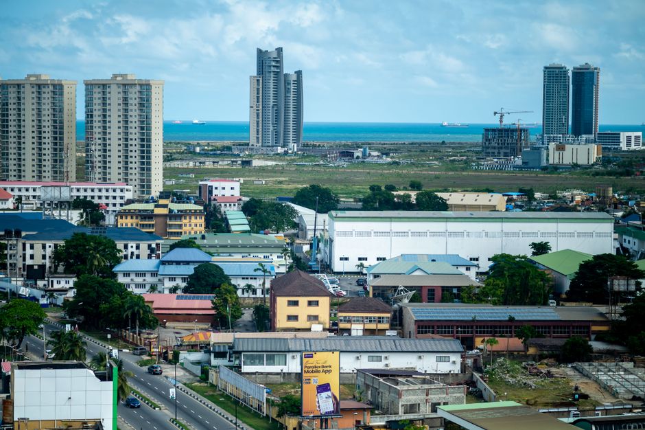 Modern cityscape of Lagos, Nigeria, with residential and commercial buildings near the ocean.