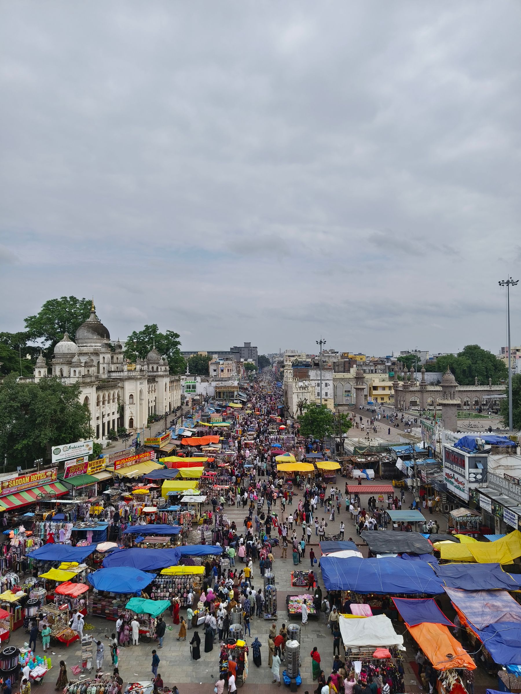 Bustling outdoor market with colorful stalls in Hyderabad