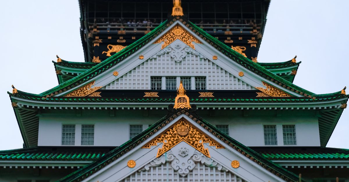 Osaka Castle rising above the surrounding park grounds.