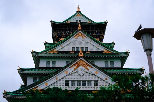 Front view of the historic Osaka Castle featuring traditional Japanese architecture and ornate details.