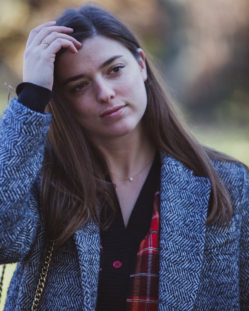 Photo of Woman Wearing Gray Notched Lapel Blazer