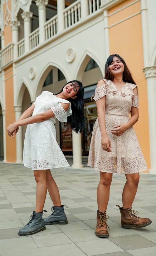 Two Women Wearing Dress