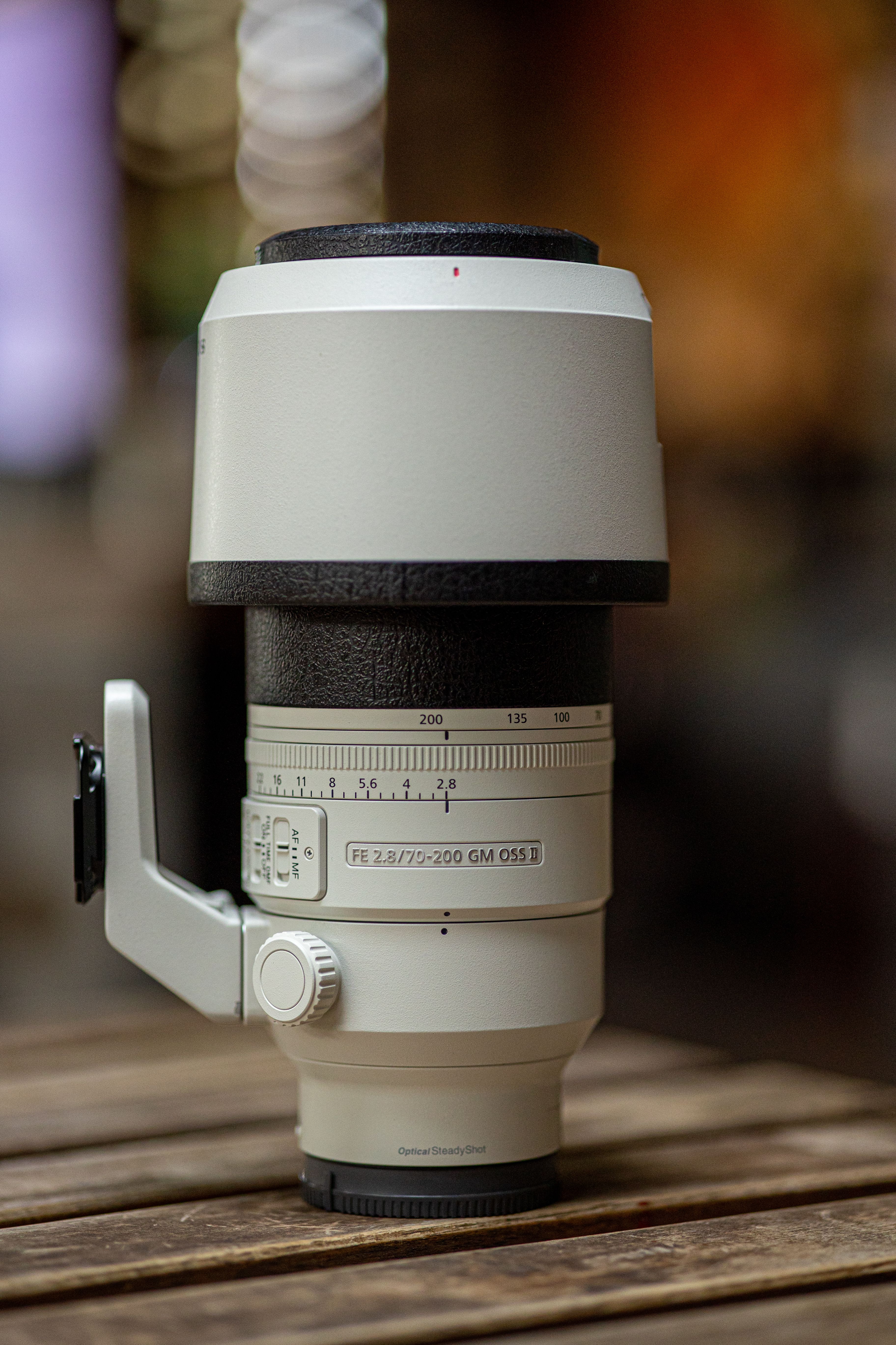 Professional Camera Lens on Wooden Table · Free Stock Photo