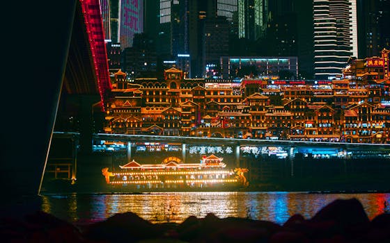 Vivid neon lights illuminate Chongqing's cityscape with reflections on the river, creating a cyberpunk atmosphere.