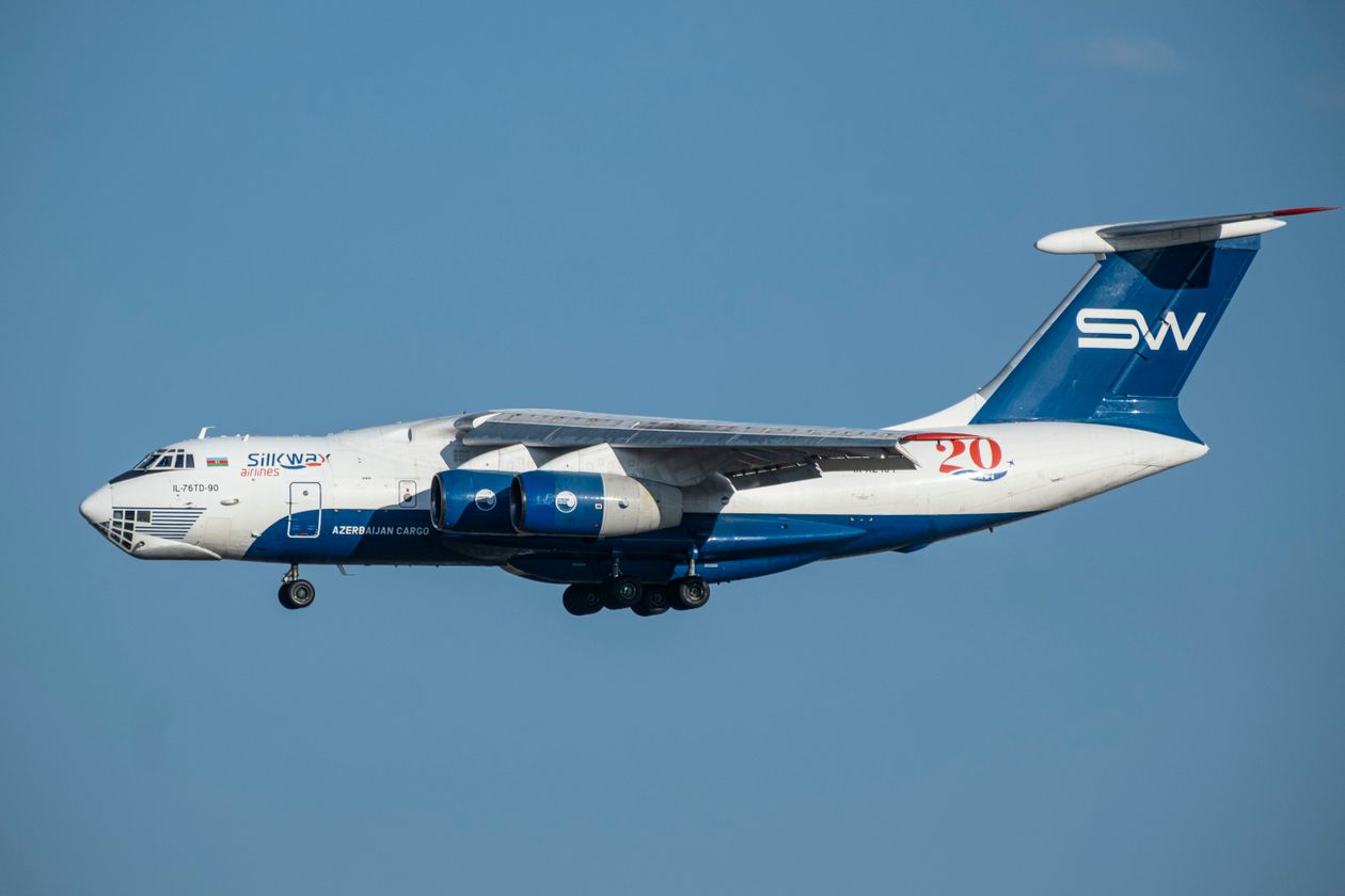 Heavy cargo aircraft in flight carrying urgent freight