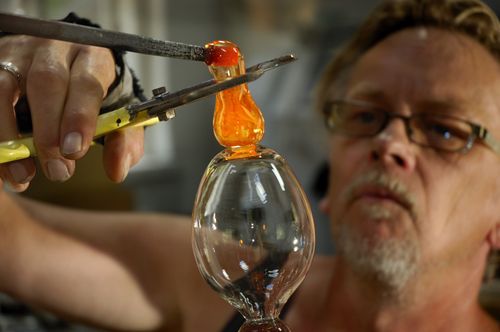 Free Skilled artisan shaping hot glass with precision in Svendborg, Denmark. Stock Photo
