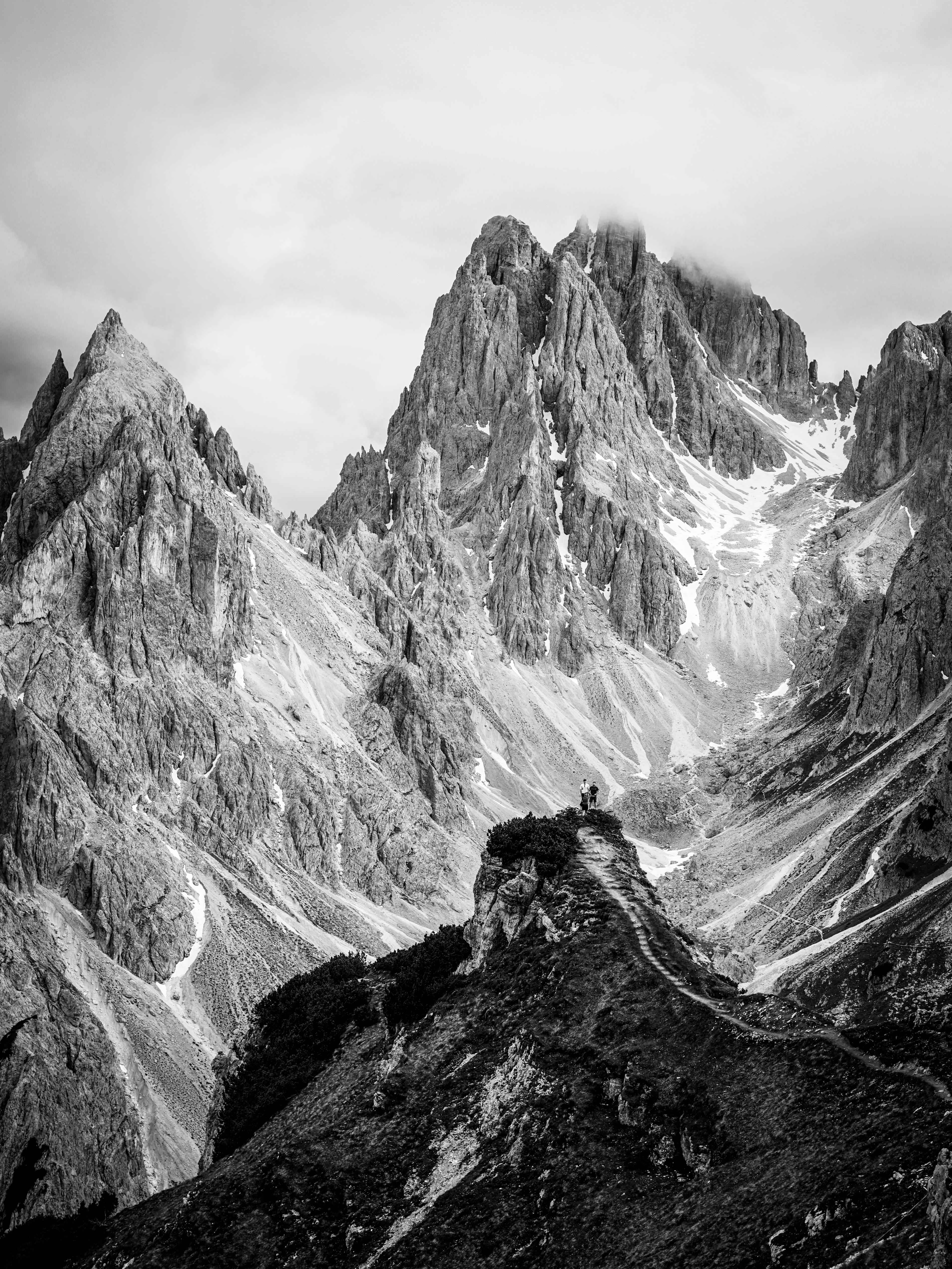 Stunning black and white photo of the Dolomite Mountains, Italy's rugged peaks.