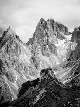 Stunning black and white photo of the Dolomite Mountains, Italy's rugged peaks.