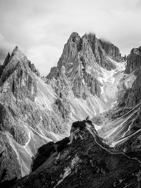 Stunning black and white photo of the Dolomite Mountains, Italy's rugged peaks.