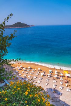 Stunning aerial view of sun loungers on Kaputaş Beach with turquoise waters in Antalya, Türkiye.