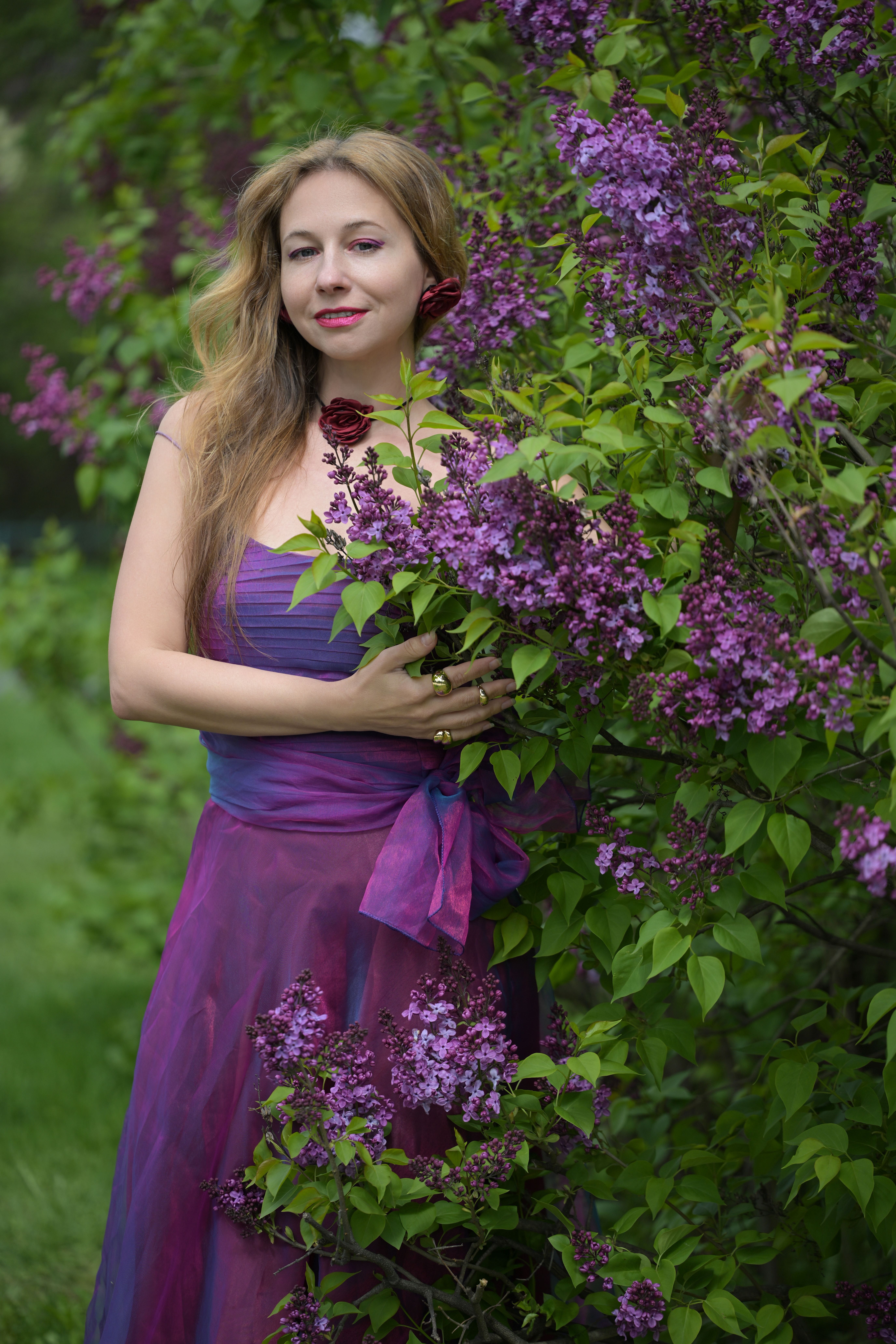 Woman in Purple Gown with Lilac Flowers Outdoors · Free Stock Photo