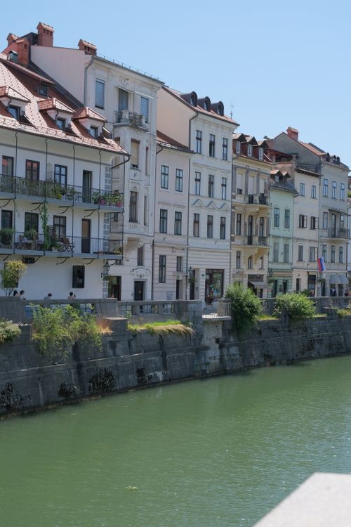 Free Picturesque view of historic buildings along the Ljubljanica River in Ljubljana, Slovenia. Stock Photo