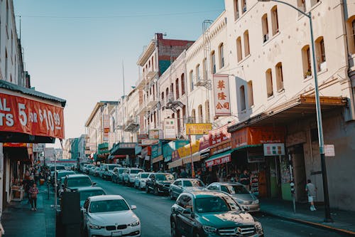 Cars on Road Near Buildings