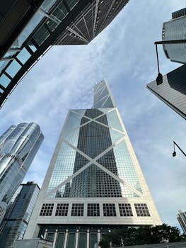 Stunning view of Bank of China Tower against a blue sky in Hong Kong.