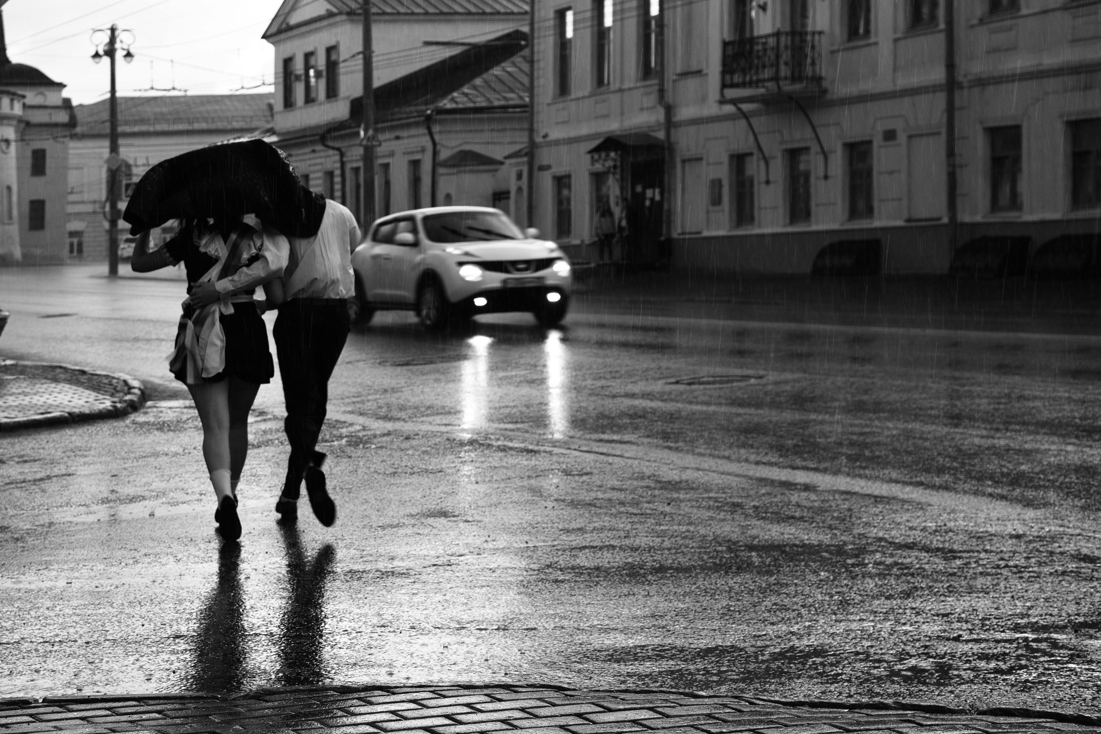 two person crossing the street