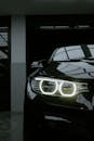 Elegant Black Car with Illuminated Headlights
