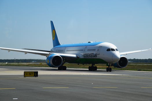 Uzbekistan Airways Boeing 787-8 taxiing at Frankfurt Airport on a clear day.
