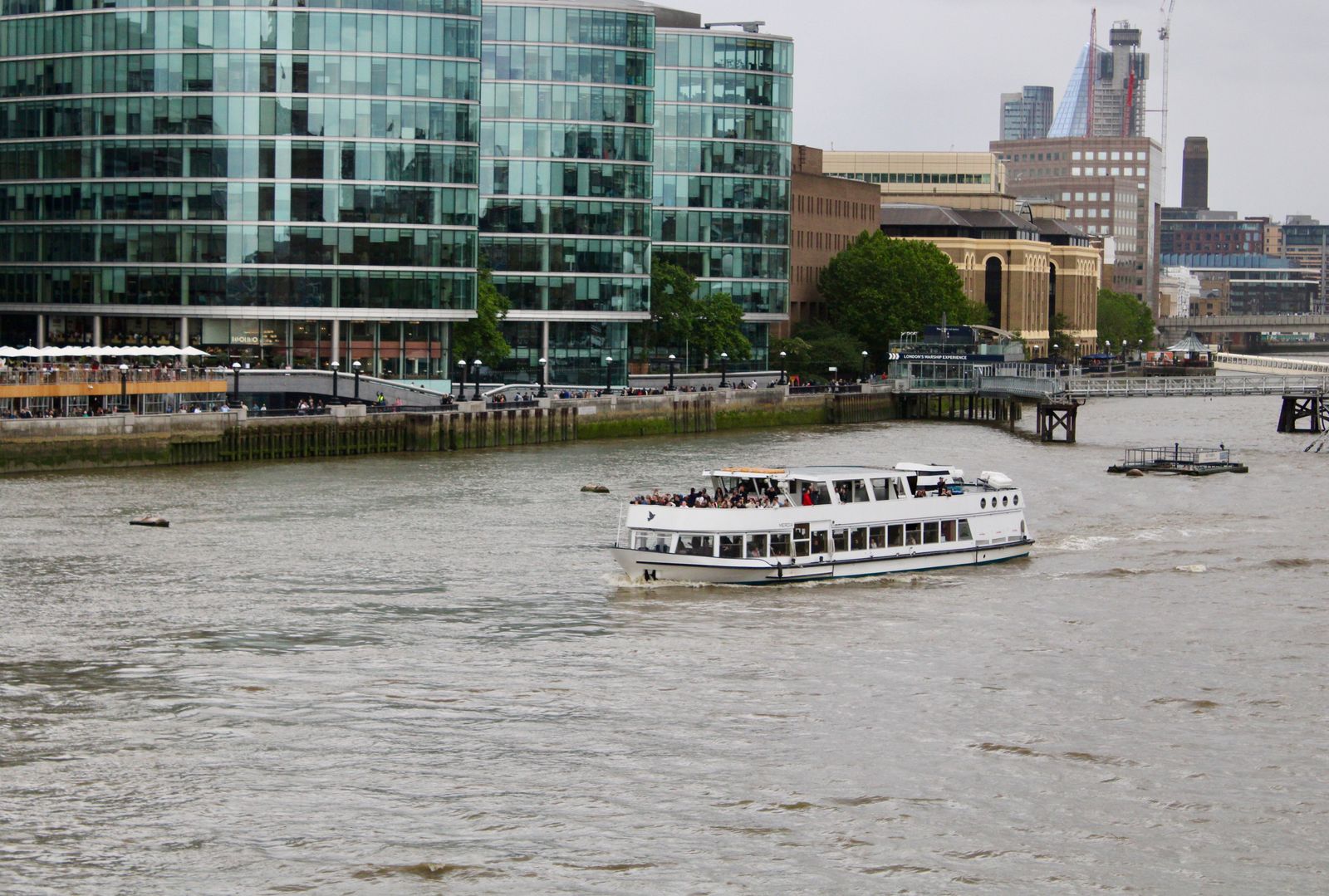 A Thames sightseeing vehicle on the river with the London skyline behind it