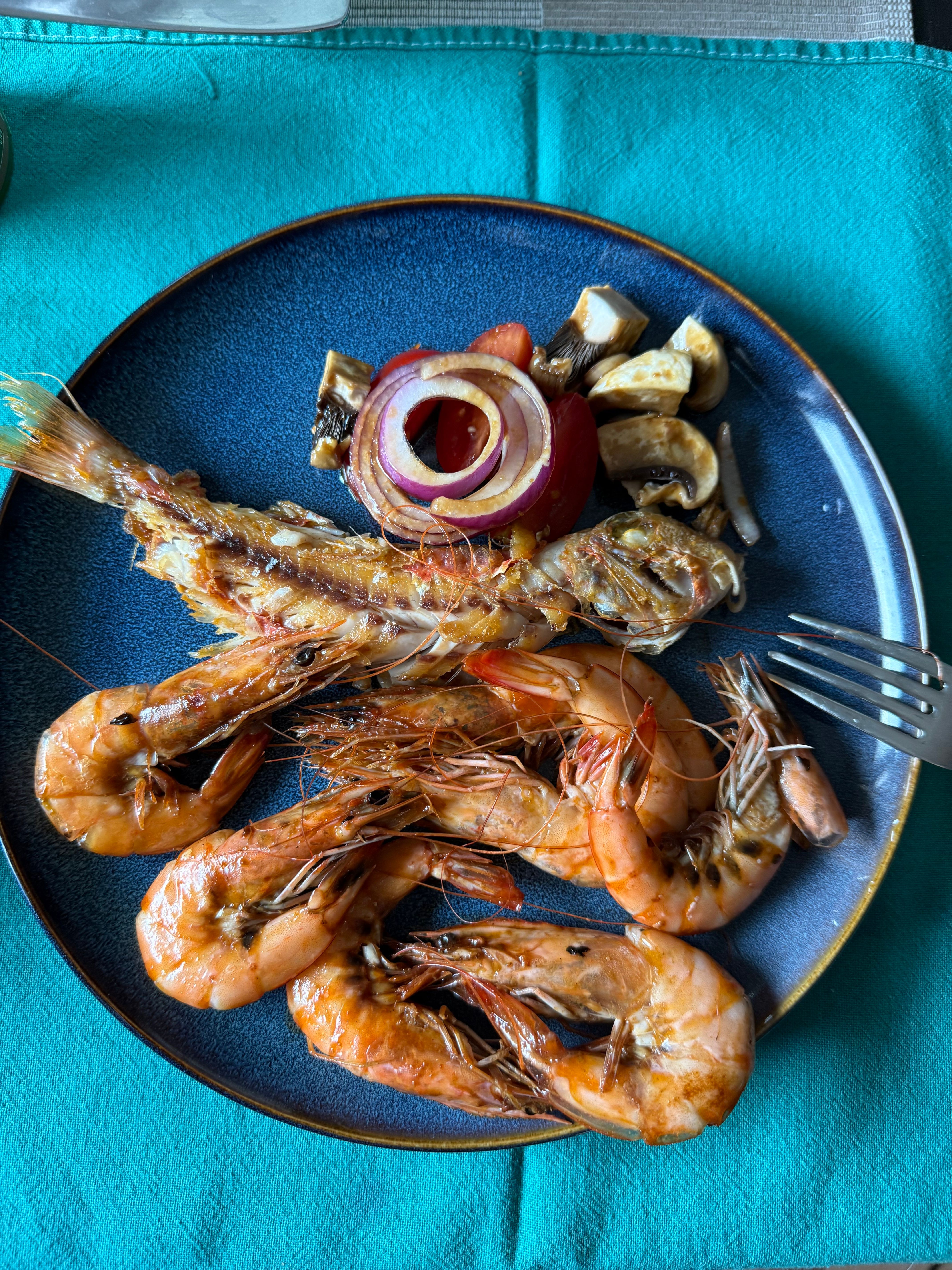 grilled gizzard shad and shrimp on plate