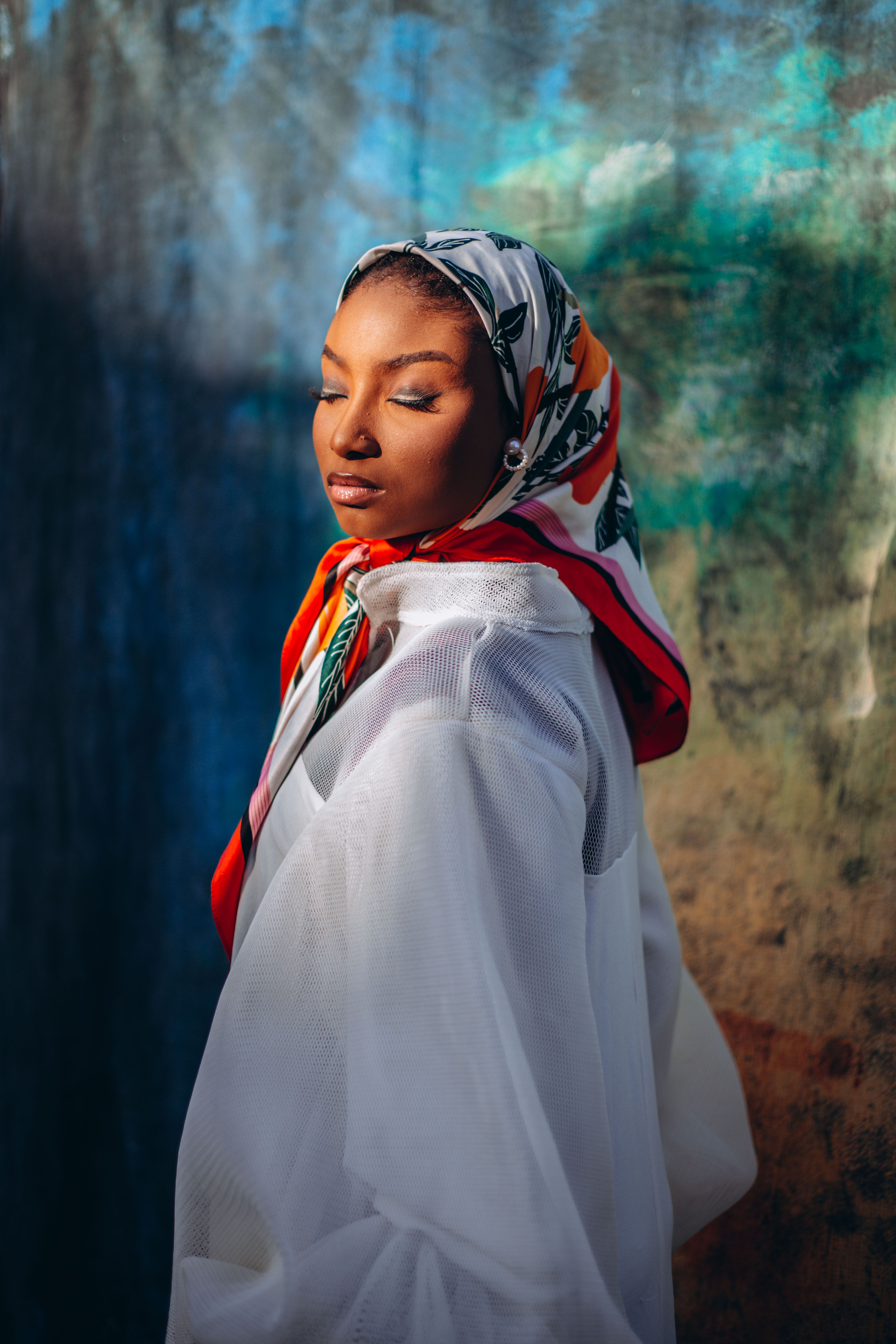 Elegant Portrait of Woman in Colorful Headscarf · Free Stock Photo