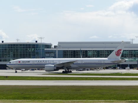 Air China Boeing 777 aircraft preparing for departure at a modern airport terminal.