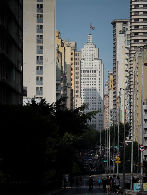 Free City skyline featuring skyscrapers and bustling street view under bright daylight. Stock Photo