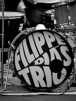 Black and white photo of a drum set featuring the Filipe Dias Trio logo on the bass drum.