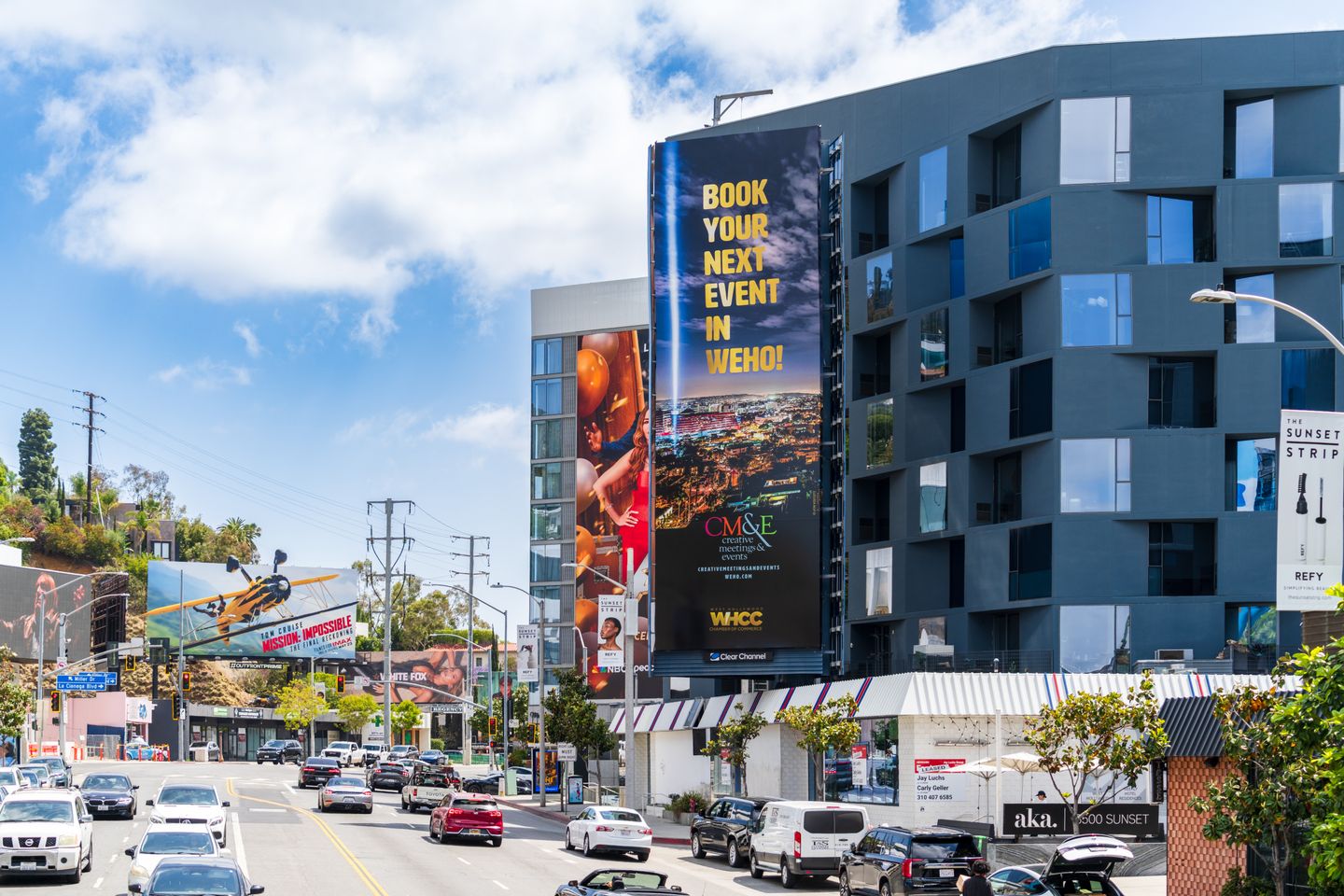 West Hollywood Sunset Strip street view with buildings, billboards, and daytime traffic