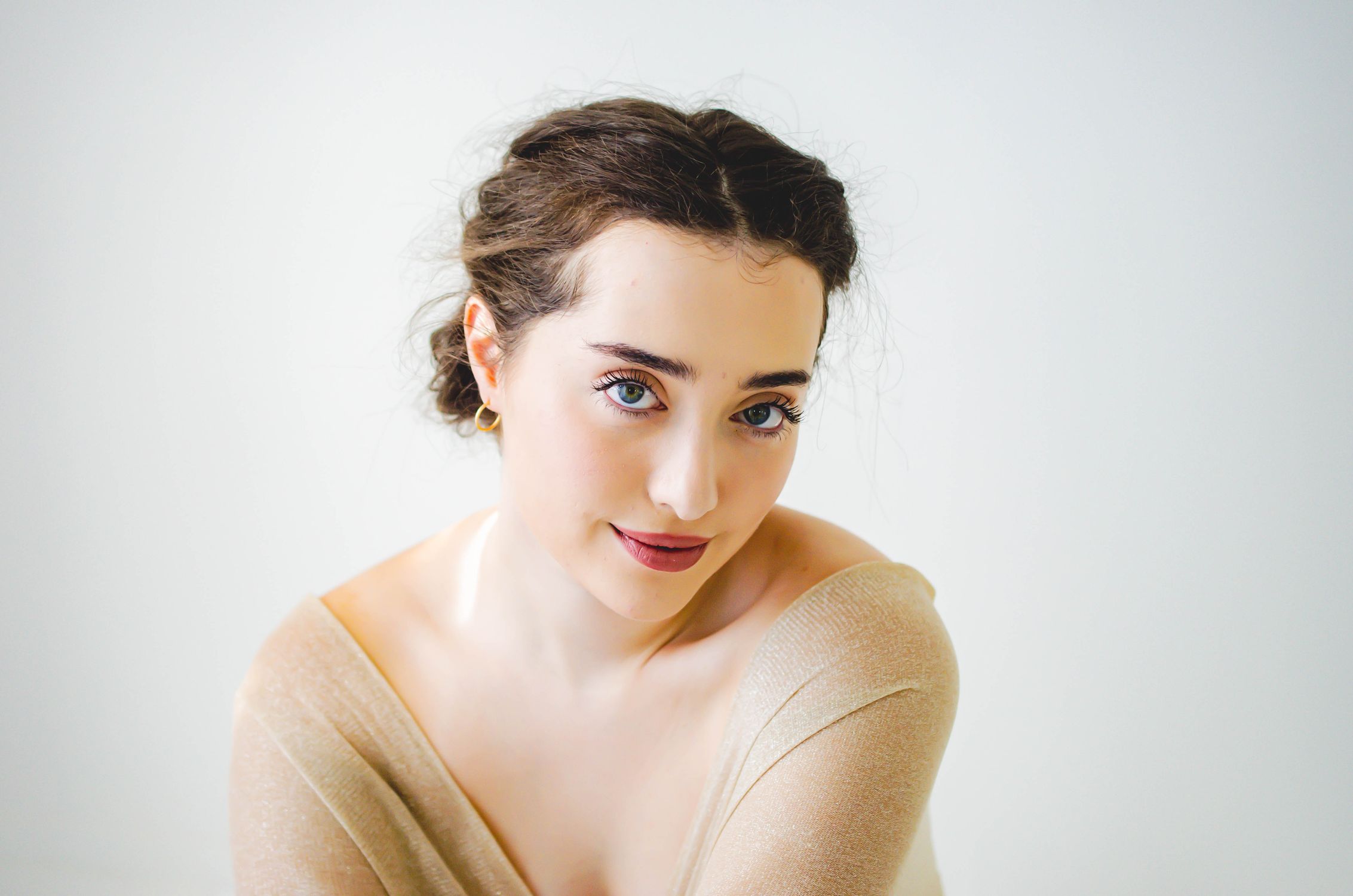 Bright Portrait of a Young Woman with Soft Expression · Free Stock Photo