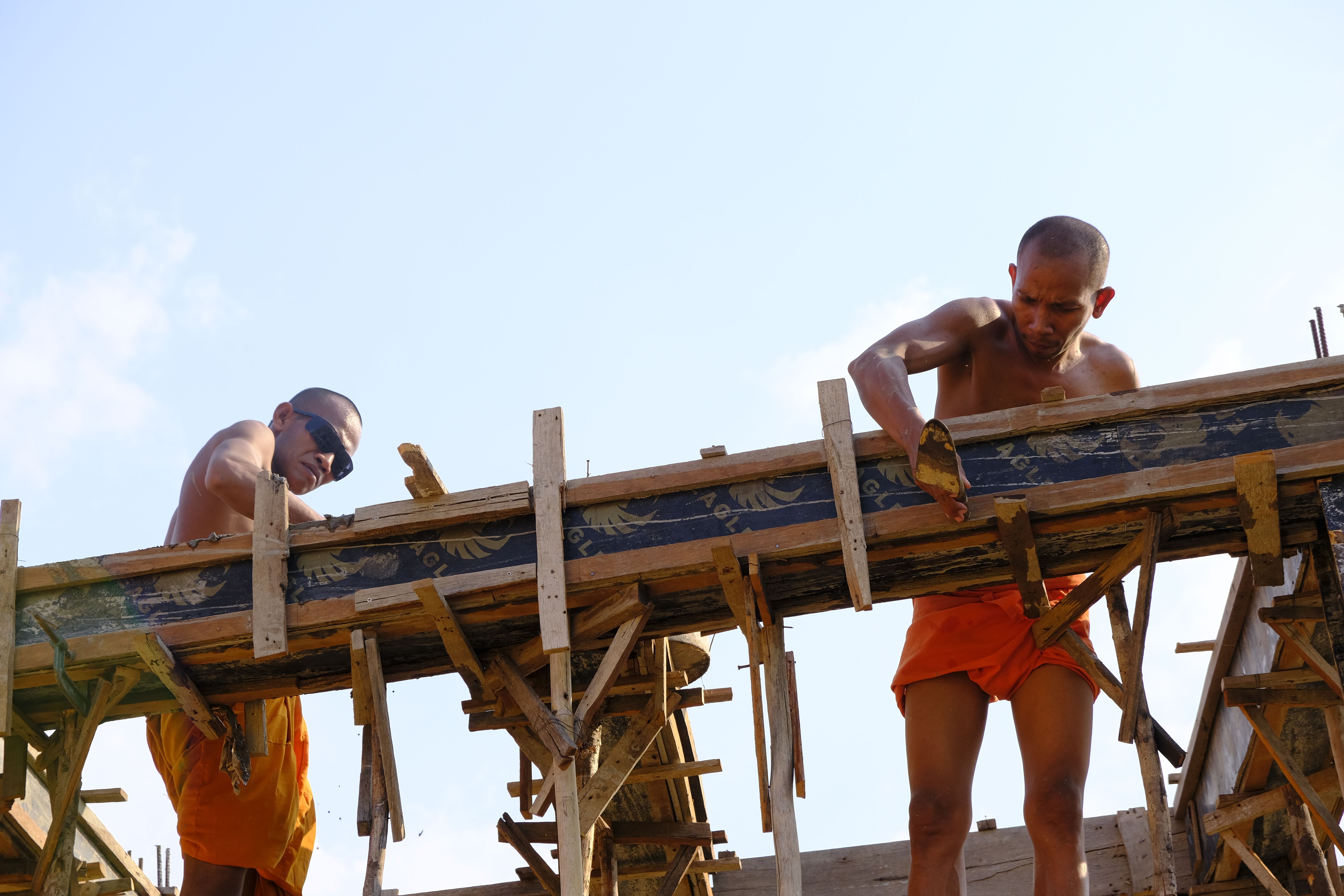 Monks Engaged in Temple Construction Work in Cambodia · Free Stock Photo