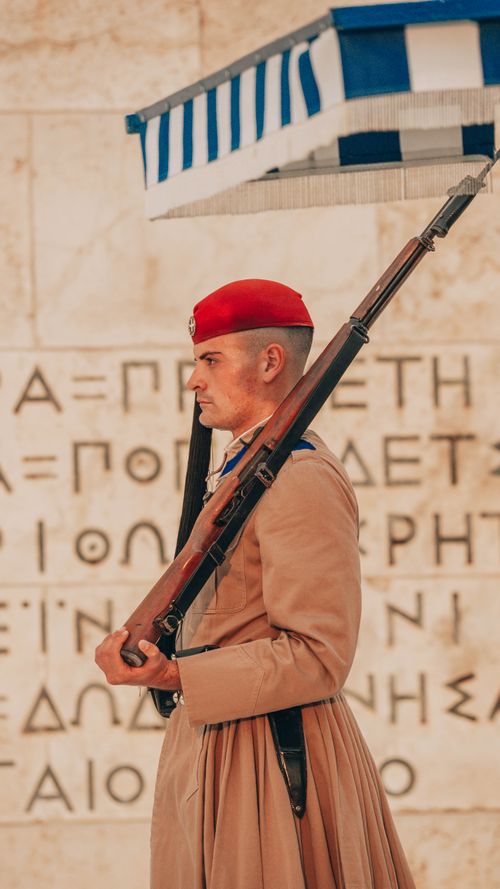 Free Greek soldier in traditional uniform at the Tomb of the Unknown Soldier in Athens. Stock Photo