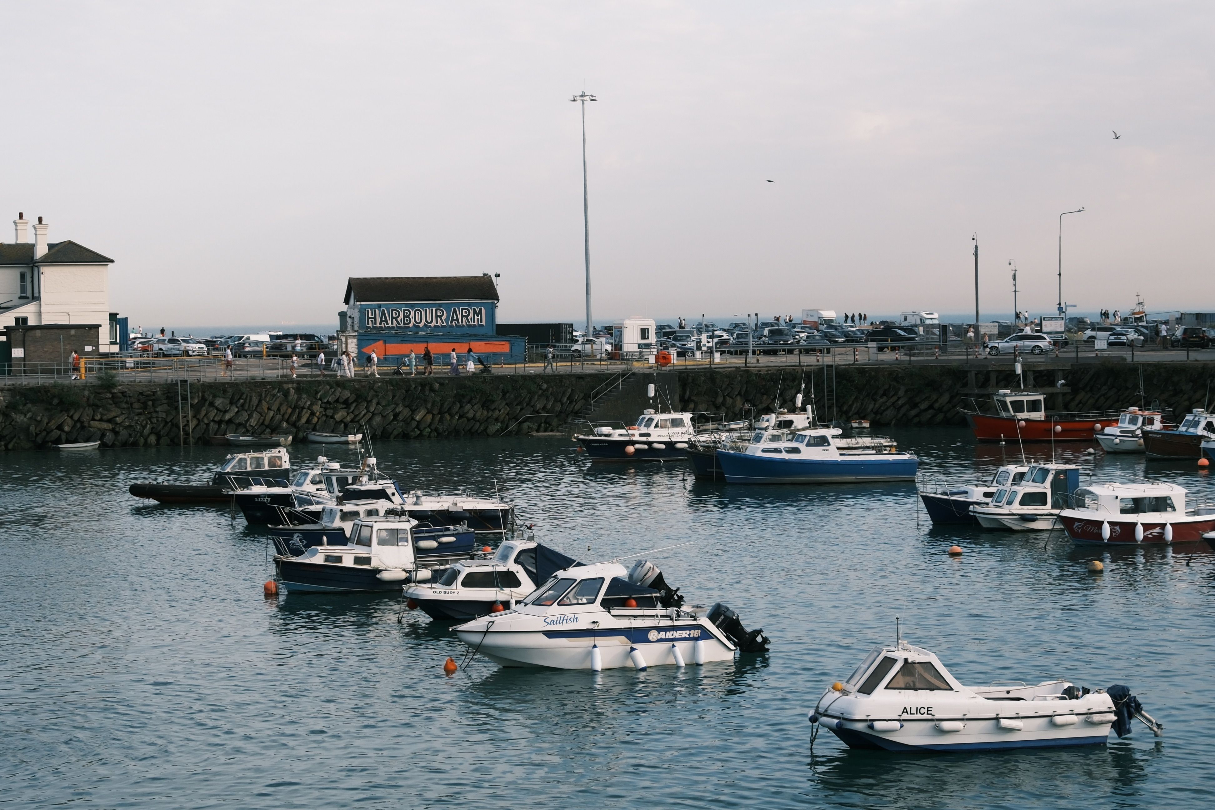 Scenic view of a harbour with moored boats at dawn