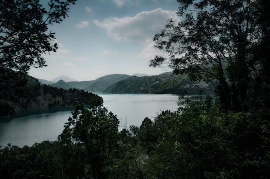 Serene view of a mountain lake nestled in Auvergne-Rhône-Alpes, France.