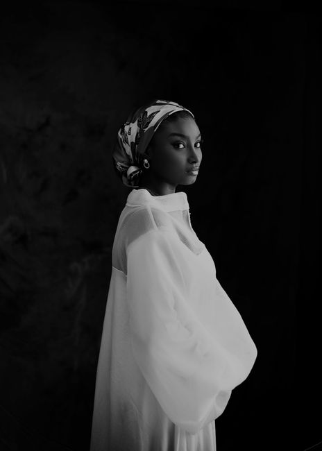 A stunning black and white portrait of a woman in traditional attire, exuding elegance.