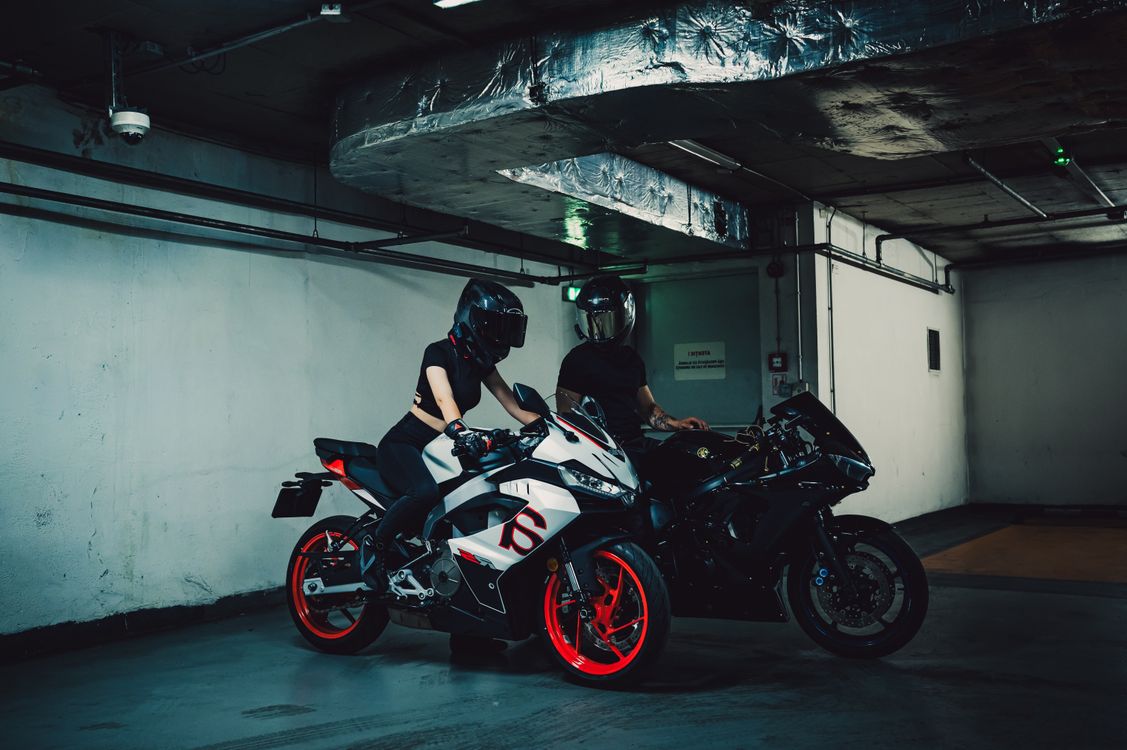 Underground Riders Club Motorcyclists in Underground Garage at Night · Free Stock Photo