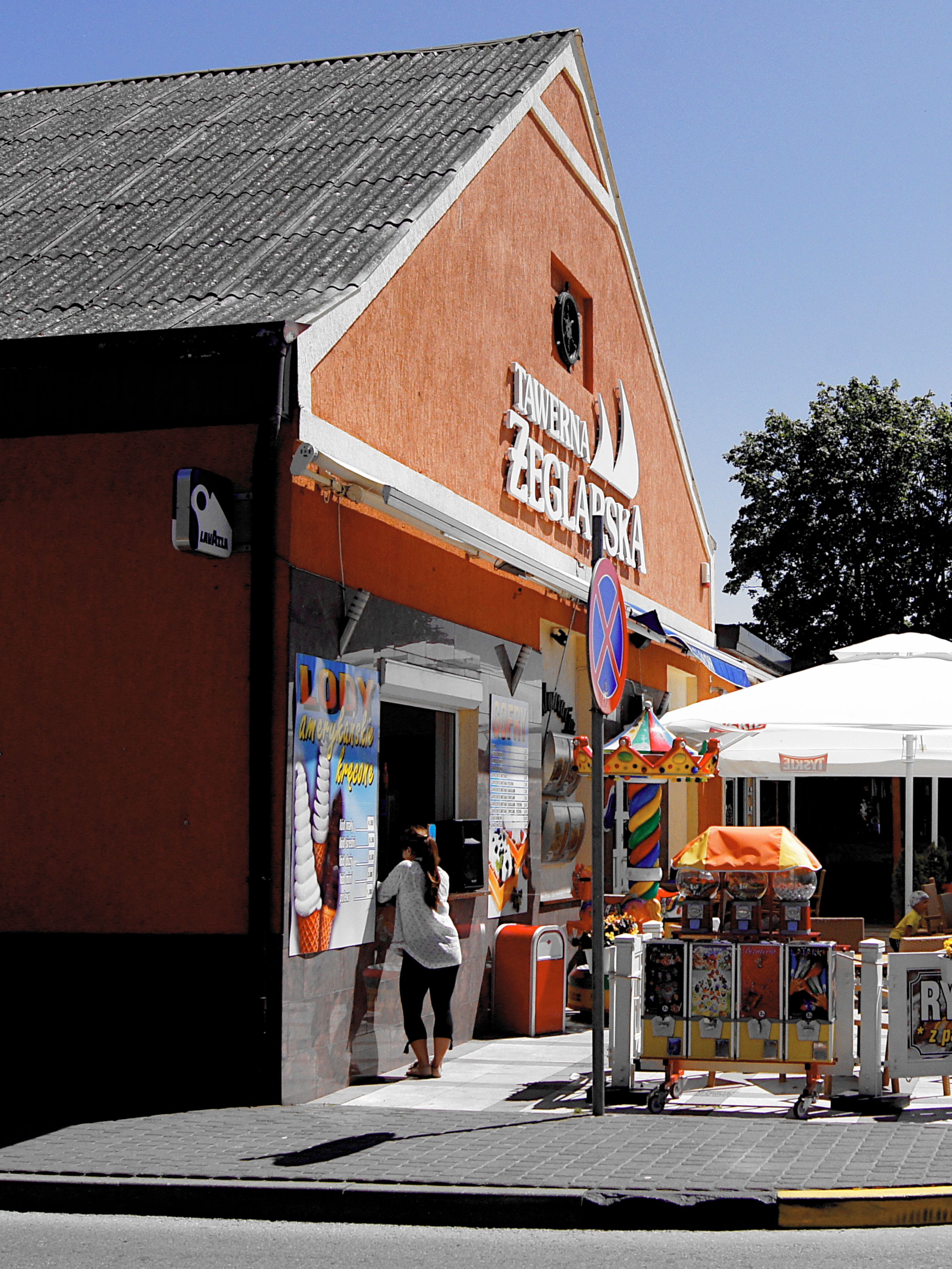 A colorful street scene with an inviting tavern and vibrant decor.