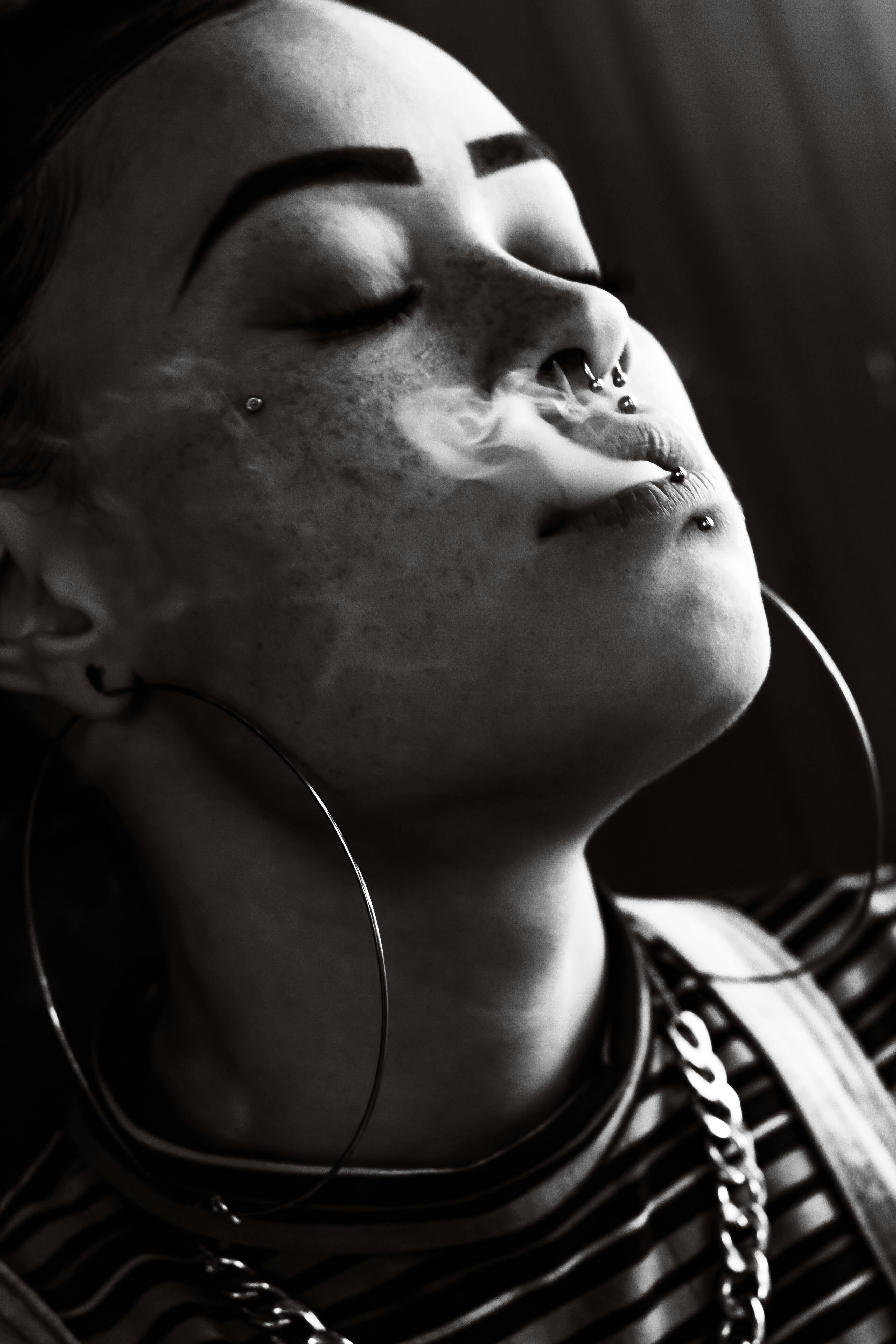 Woman Breathing Smoke · Free Stock Photo