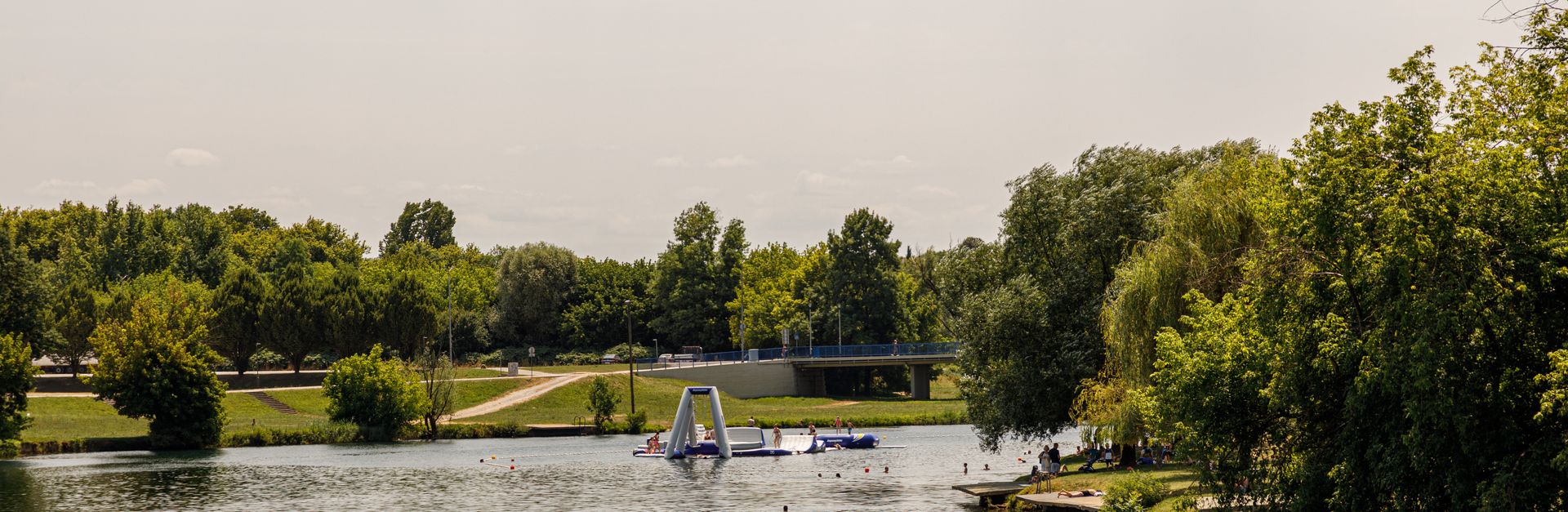 Beautiful summer view of the river and lush greenery in Karlovac, Croatia, under a sunny sky.