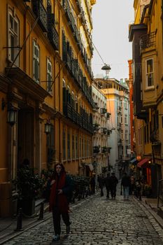 Explore the vibrant streets of Beyoğlu in İstanbul, showcasing historic architecture and lively street life.