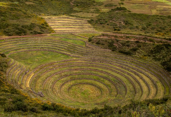 Explore the ancient Incan agricultural terraces of Moray in Cusco, Peru, from above.