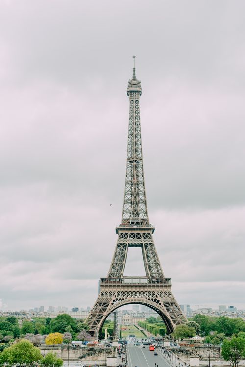 Free Elegant view of the Eiffel Tower in Paris on a cloudy day. Stock Photo