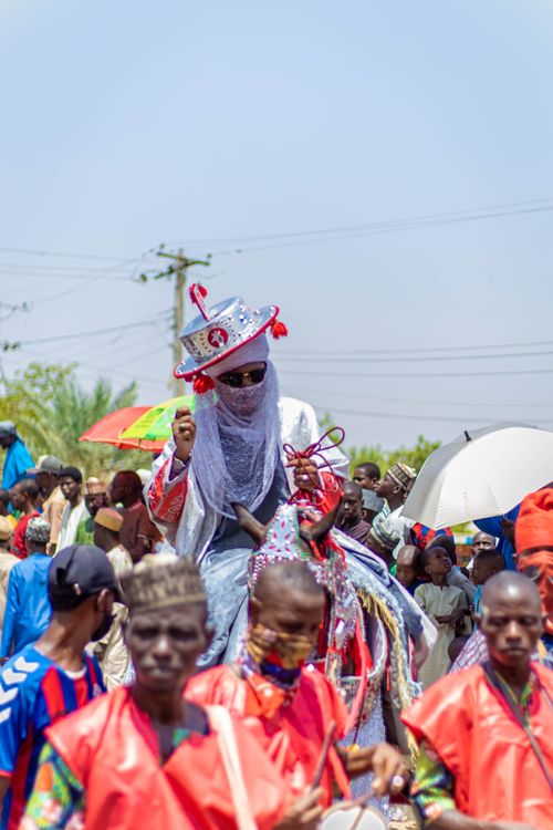 Free Vibrant scene of a cultural parade, showcasing traditional costumes in a lively celebration outdoors. Stock Photo