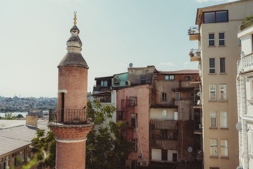 Free View of historic Istanbul minaret and urban skyline. A blend of tradition and modern living. Stock Photo